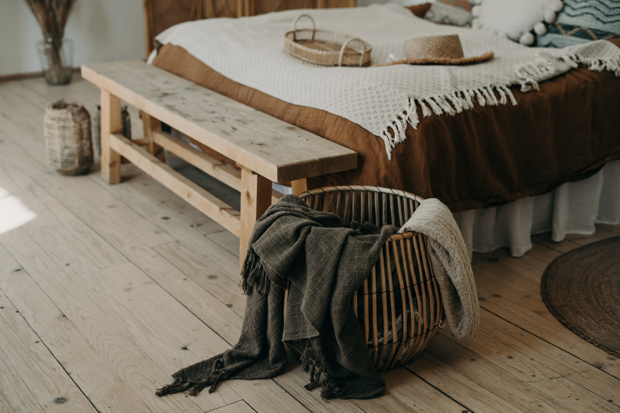 A bench is the perfect way to make your bedroom feel cozier. Click here for a guide to decorating with a wood bedroom bench.